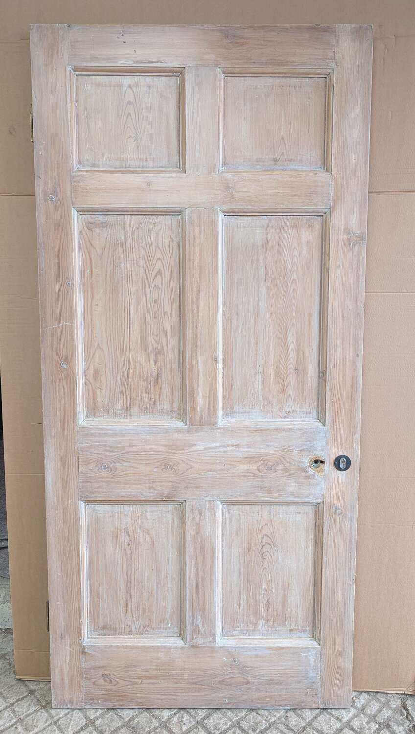 A VERY LARGE RECLAIMED SIX PANEL PINE INTERNAL DOOR